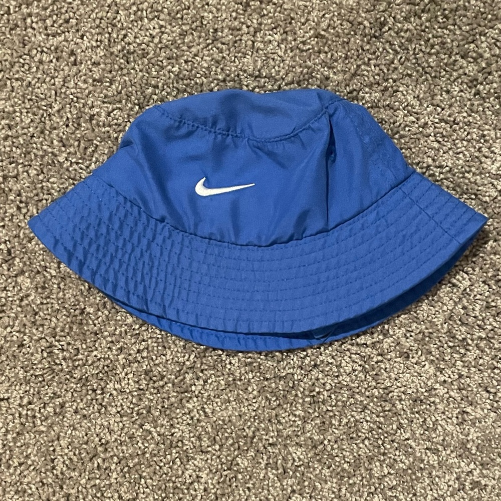 Infant blue Nike bucket hat with Velcro straps